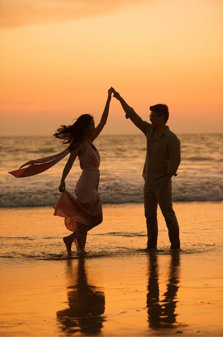 Holding hands by the sea