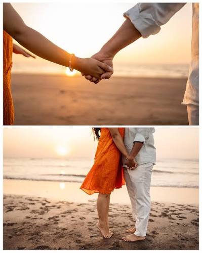 Couple walking hand in hand at dusk