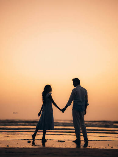 Dancing on the beach at sunset